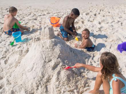kids making sand castles on the beach in gulf shores