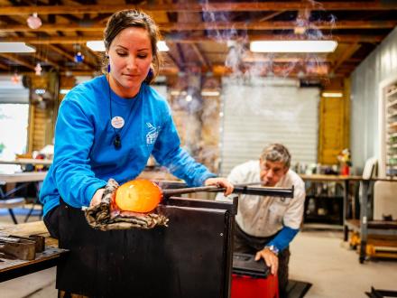 Artists creating glass blown ornaments at The Hot Shop in Orange Beach