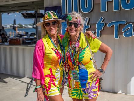 Two Meeting of the Minds attendees decked out in tropical attire