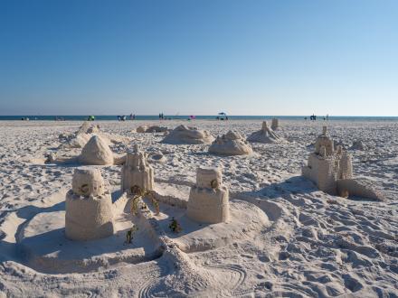 sandcastles on the beach at the sandcastle competition at shrimp fest in gulf shores