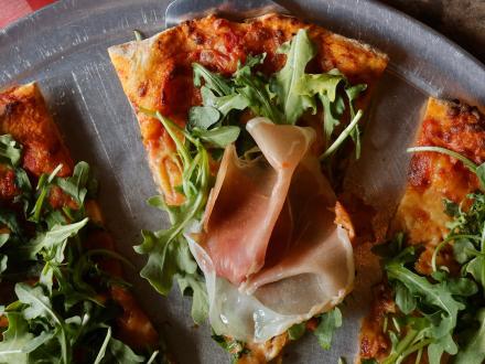 Arugula and prosciutto pizza at Tuscany Pizza & Grill Italian Restaurant in Gulf Shores