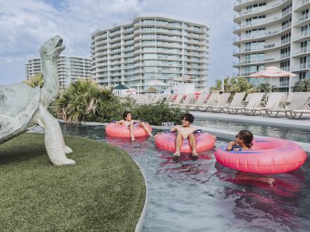 kids floating in the lazy river at The Caribe waterfront resort in Orange Beach
