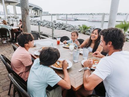 family dining at Cobalt waterfront restaurant at The Caribe Resort in Orange Beach