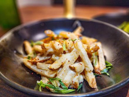 A plate of house cut fries at Bolo restaurant in Orange Beach