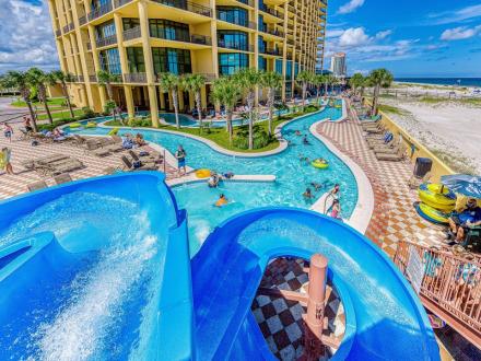Waterslide, pool, and lazy river at The Oasis beachfront condo in Orange Beach