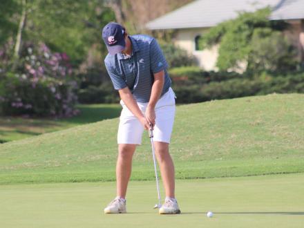 Man putting on the greens at Craft Farms Golf Club in Gulf Shores