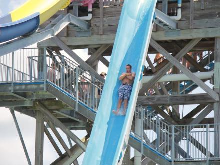 Man going down a waterslide at Waterville USA waterpark in Gulf Shores