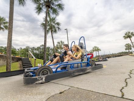 Family racing go-karts at The Track Family Fun Park in Gulf Shores