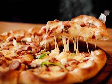 A pan with a fresh, hot pizza