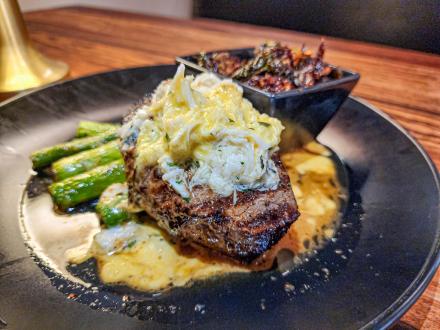 Steak and vegetables at Bolo Seafood & Steak restaurant in Orange Beach