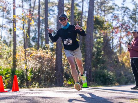 Runner racing along the trails in Gulf State Park in Orange Beach