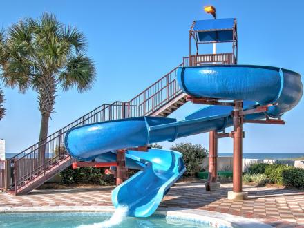 Waterslide and pool at The Oasis beachfront resort in Orange Beach