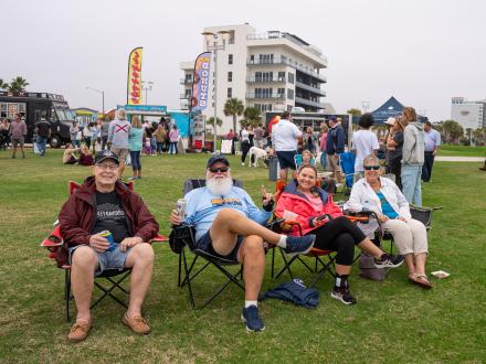 Snowbirds enjoying the Annual Coastal Alabama Food Truck Festival in lawn chairs