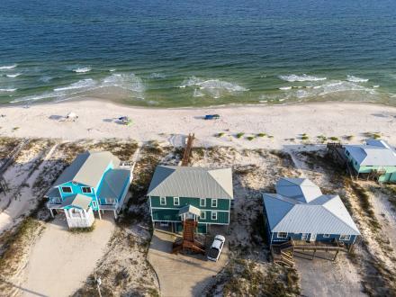 Colorful beach houses along the shore in Fort Morgan