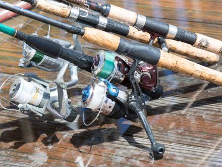 Fishing rods laying on a pier in Gulf Shores