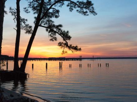 Sunset over Wolf Bay at Orange Beach Waterfront Park