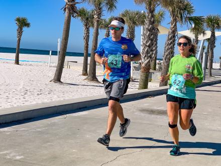 Couple racing in the Sea Turtle Half Marathon in Gulf Shores