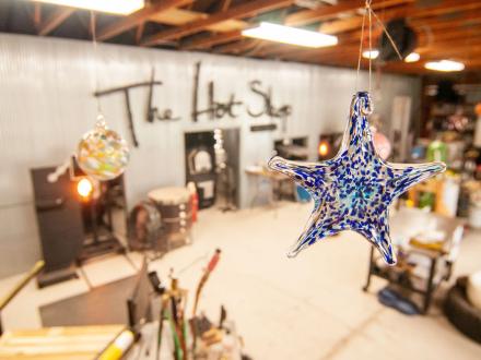 the hot shop glass blowing studio at the coastal arts center in orange beach