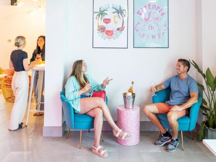 Couple sipping wine at Gulf Babe Wine Boutique in Gulf Shores