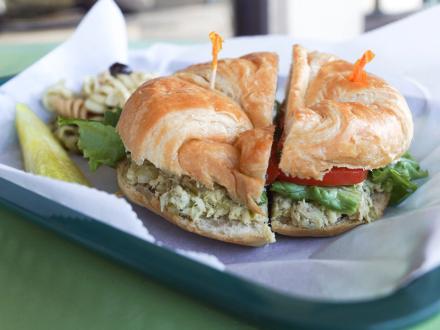 Chicken salad sandwich and sides at Amelia's Deli lunch restaurant in Gulf Shores