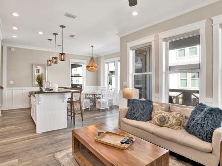 Modern living room and kitchen at Coconut Lagoon vacation home in Gulf Shores