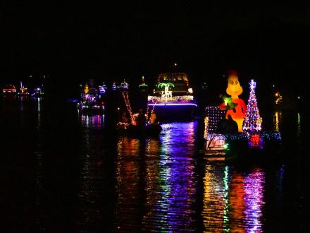 decorative and lighted boats cruising down the Intracoastal Waterway during the lighted boat parade in Gulf Shores