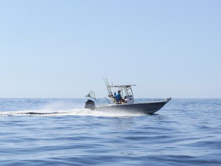 Boat cruising through the Gulf in Orange Beach