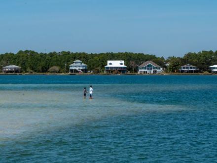 Anglers wade fishing in Little Lagoon in Gulf Shores