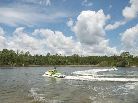 People Jet skiing in the scenic backbays of Orange Beach