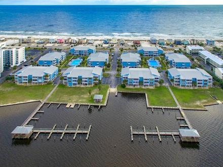 Aerial view of Sea Oats waterfront condo community on Little Lagoon in Gulf Shores