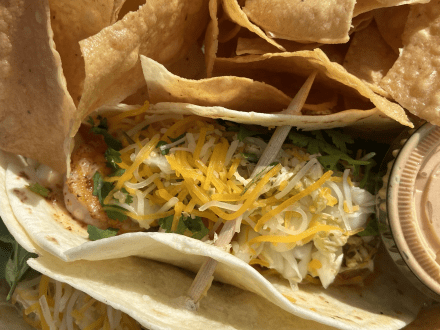 Shrimp tacos and tortilla chips at Wolf Bay seafood restaurant in Orange Beach