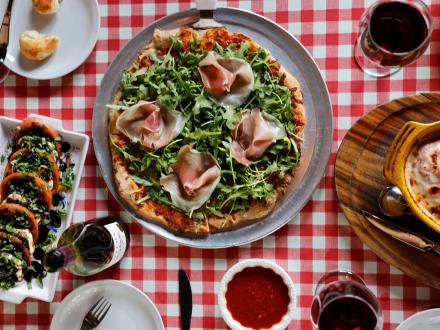 Pizza, wine, and appetizers at Tuscany Italian restaurant in Gulf Shores
