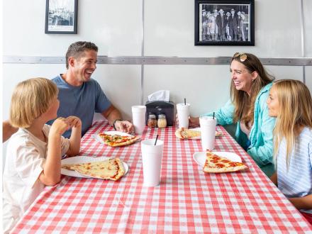 Family dining at Vinny's Pizzeria at The Wharf in Orange Beach