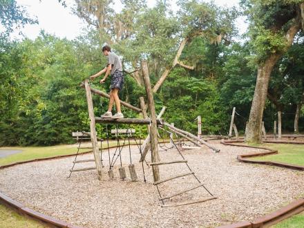 Person climbing at AL's Parkour Challenge inside Gulf State Park