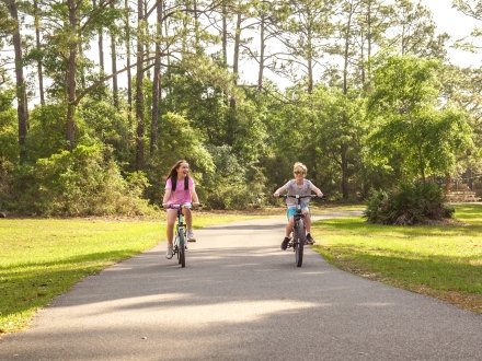 Children biking on Alabama's Beaches