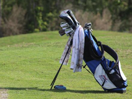 Golf bag sitting on the greens at Craft Farms golf course in Gulf Shores