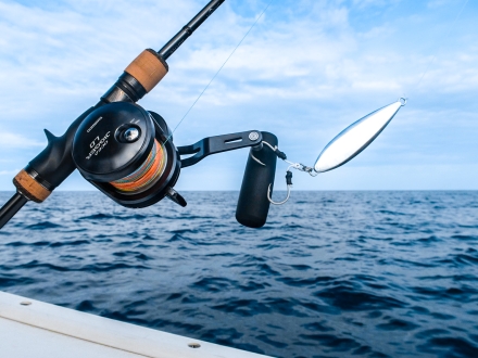 Fishing rod casted off the side of a charter boat in orange beach