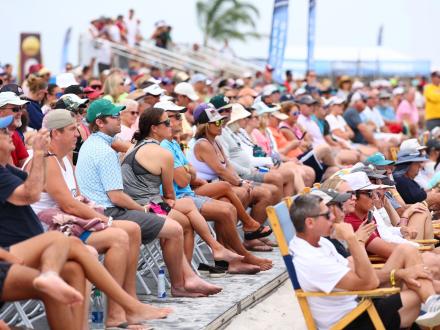 Fans watching the NCAA Beach Volleyball Championship along the beaches of Gulf Shores