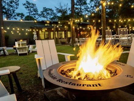 fire pit at Woodside outdoor restaurant in Gulf State Park