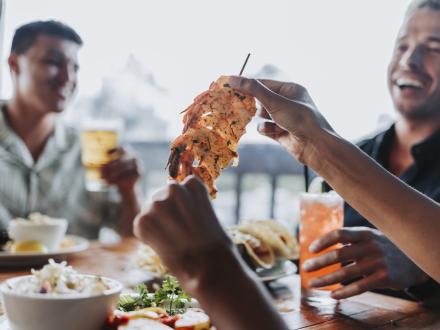 Friends eating on Alabama's Beaches