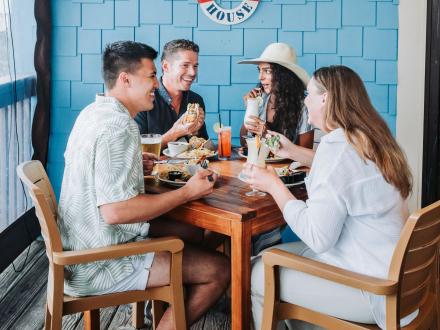 friends dining at beach house kitchen and cocktails seafood restaurant in gulf shores