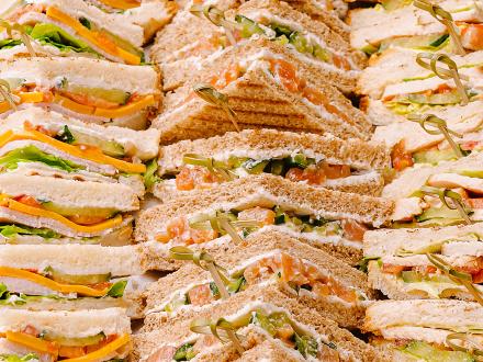 finger sandwiches on a platter