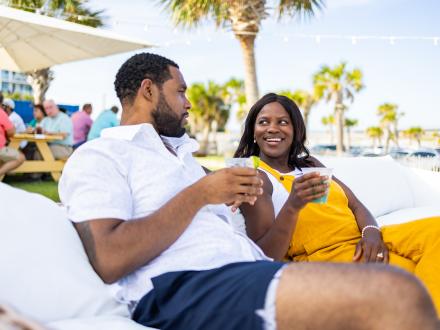 Couple enjoying drinks at The Gulf Restaurant