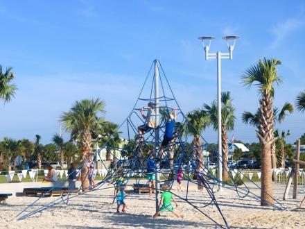 Beachfront playground at Gulf Place public beach access in Gulf Shores