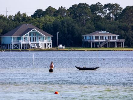 Angler wade fishing in little lagoon in gulf shores