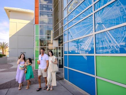 Family walking out of the AMC movie theater at The Wharf in Orange Beach