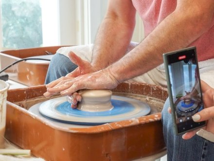 Couple making handmade pottery at The Clay Studio at the Coastal Arts Center in Orange Beach