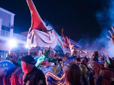 Giant marlin float at Moon Pies on Main Mardi Gras parade at The Wharf