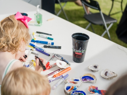 Children making oyster crafts in the Kids' Zone at the Fort Morgan Oyster Fest