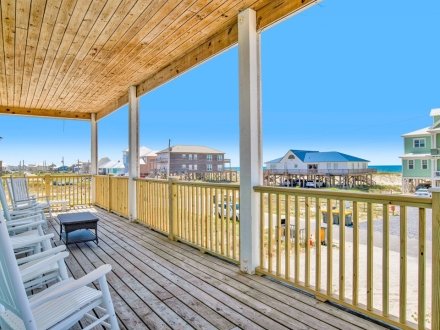 Spacious deck at Maison by the Sea beach home in Fort Morgan